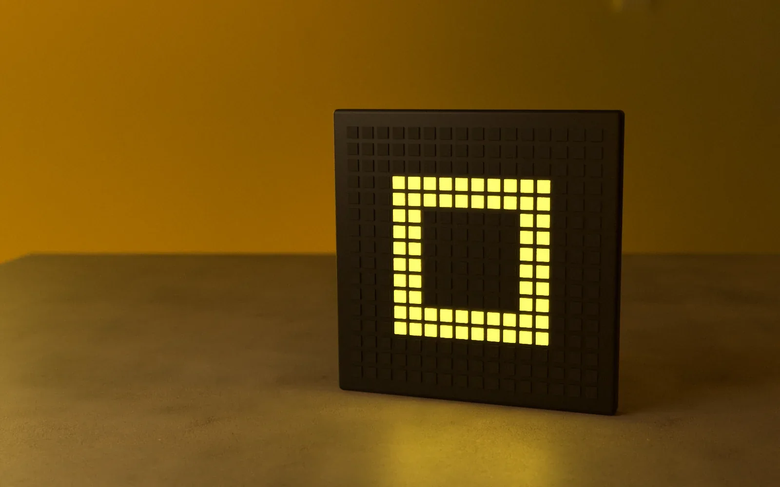 OBEGRÄNSAD Light Show — the lamp’s LED panel lit in yellow