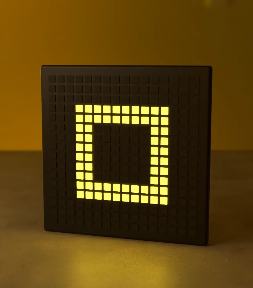 OBEGRÄNSAD Light Show — the lamp’s LED panel lit in yellow